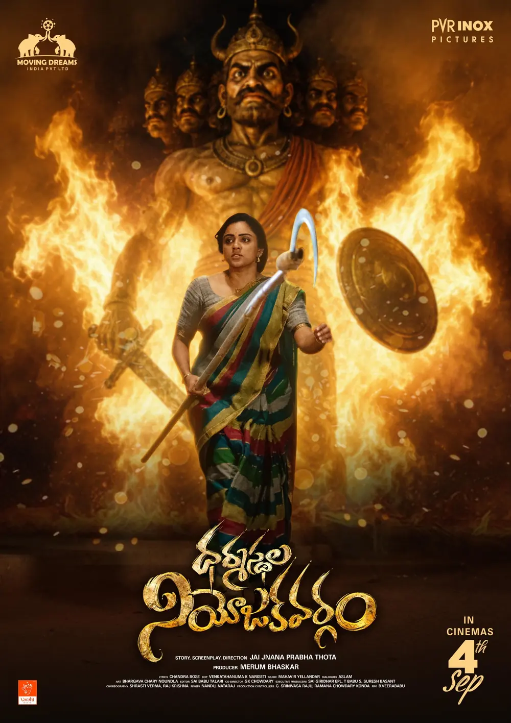 Poster: a woman with a spear in front of a burning, multi-headed effigy